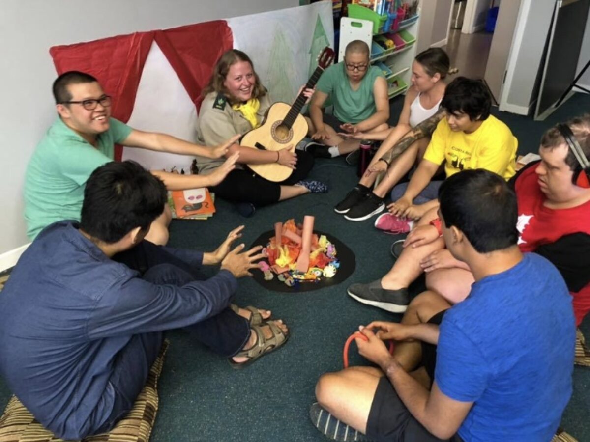 Group sitting around make believe campfire