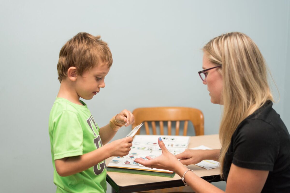 Autism instructor working with child