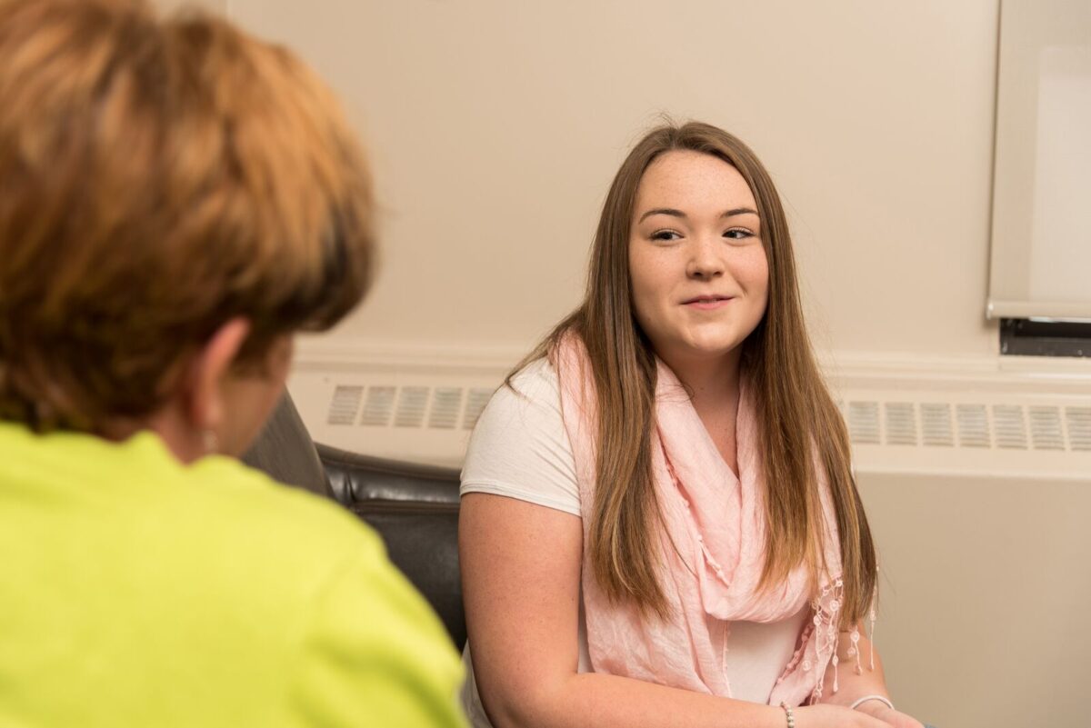 Youth listening to counsellor