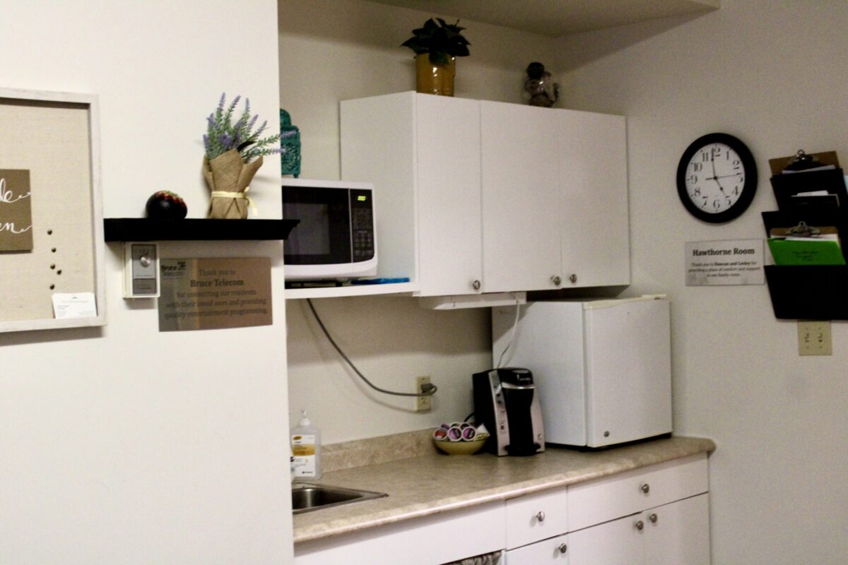 A kitchenette stocked with snacks and beverages
