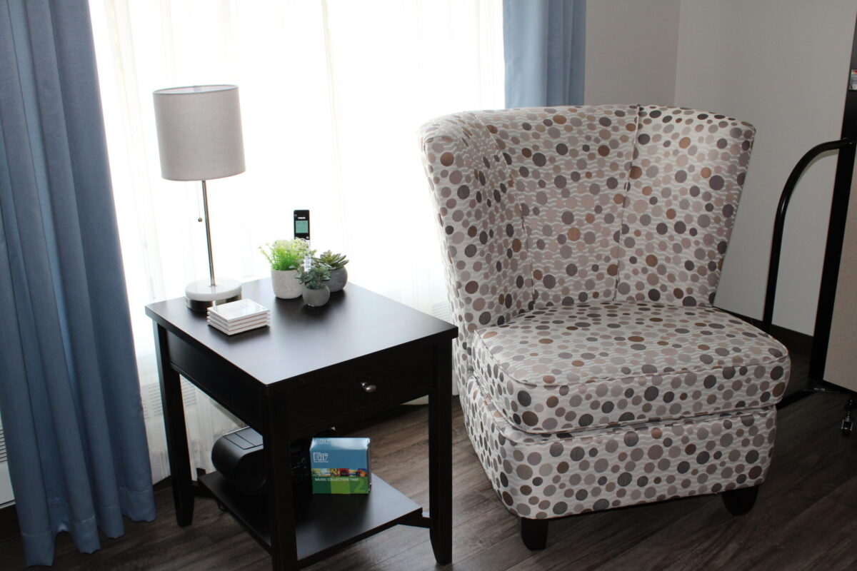 A chair with side table and reading light