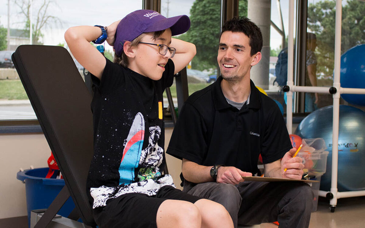 Leo with this trainer at the Adapted Fitness Centre at TVCC