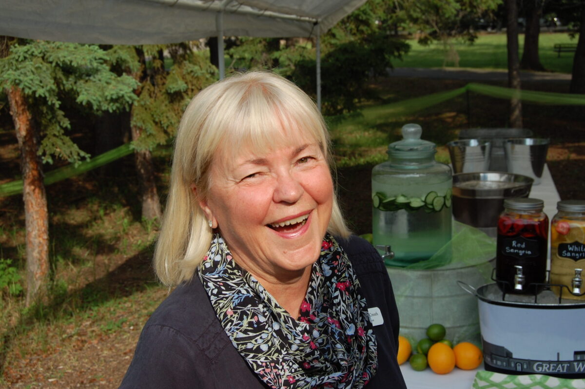 A women greets you at an event at Waskesiu Lake