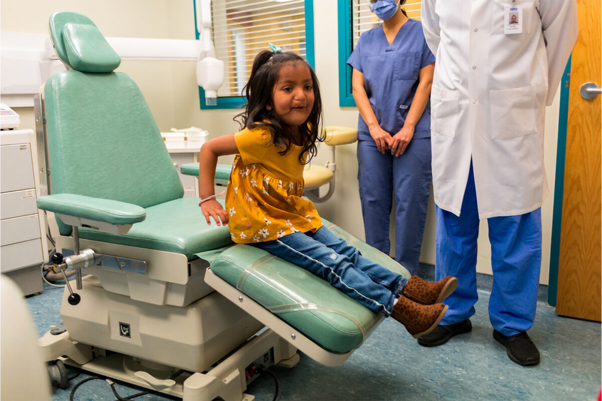 IWK patient Norah Matchett sitting in a chair at the IWK
