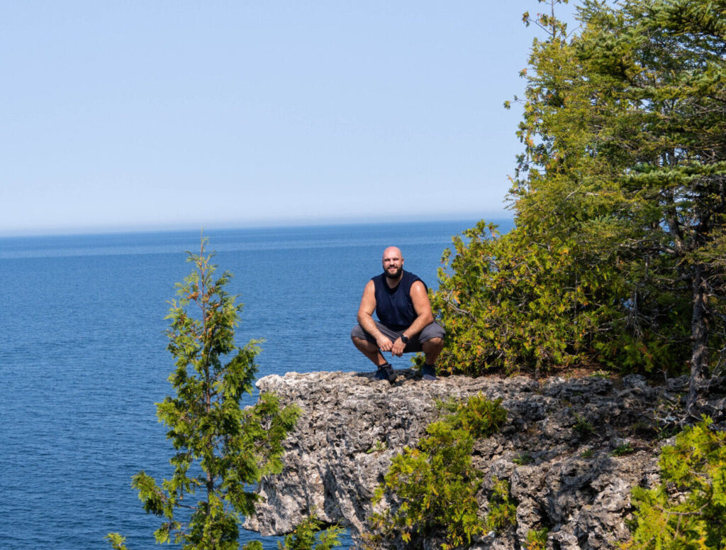 Dimitri on a fall hike at the Niagara Escarpment in Ontario, reconnecting with nature on the Bruce Peninsula.